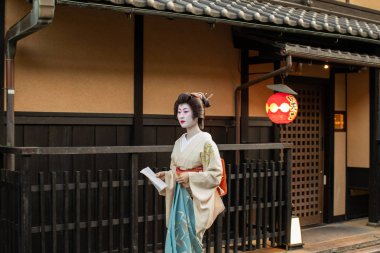 real japanese geisha, geiko in Gion area of Kyoto, Japan clipart