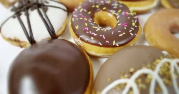 Tracking Over Selection of Iced Doughnuts — Stock Video