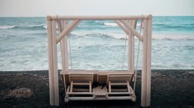 White Swing Lounger by the Sea