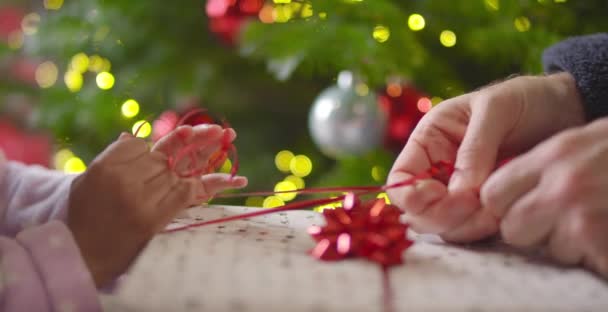 Closeup of Hands Unwrapping Present — Stock Video