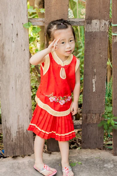 Cute Girl act to innicent wearing chinese new year