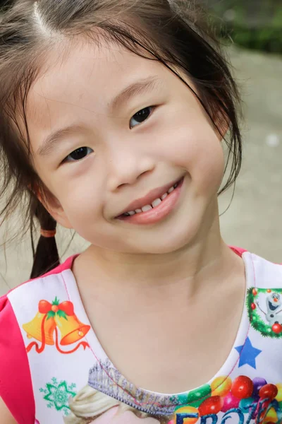 Closeup face of little asia girl is smile