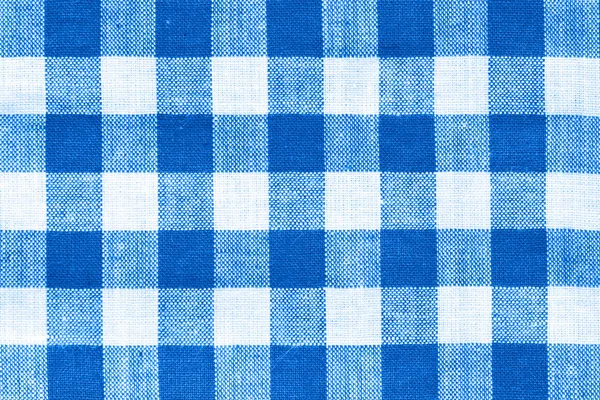 close macro view of white and royal blue  squared pattern fabric texture