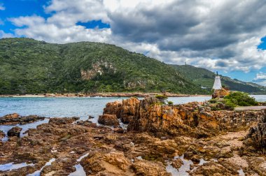 Beautiful rocky Knysna heads beach in garden route in Western Ca clipart