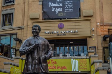 Bronze status of Nelson Mandela in Sandton city Johannesburg clipart