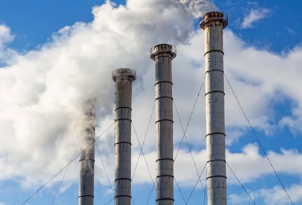 Air Pollution From Industrial Plants. Smoking industrial pipes.