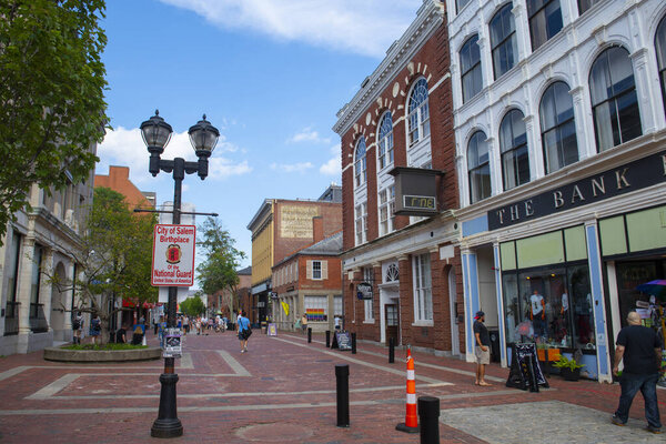 SALEM, MA, USA - JUL. 19, 2019: City of Salem Birthplace of the National Guard sign on Essex Street pedestrian street at Washington Street in Historic city center of Salem, Massachusetts MA, USA. 