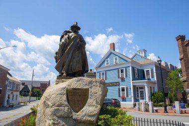 SALEM, MA, USA - JUL. 25, 2019: Roger Conant statue in front of Salem Witch Museum in Historic downtown Salem, Massachusetts MA, USA. clipart