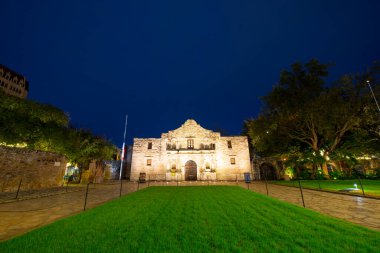 The Alamo Mission at night in downtown San Antonio, Texas, USA. The Mission is a part of the San Antonio Missions World Heritage Site. clipart