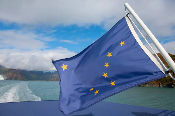 Flag of Alaska with the Big Dipper and Polaris on a boat in Aialik Bay in Kenai Fjords National Park, Kenai Peninsula, Alaska, AK, USA.