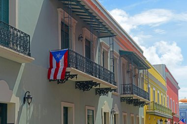 Historic building on Calle de la Fortaleza at Calle del Cristo in Old San Juan, Puerto Rico. clipart