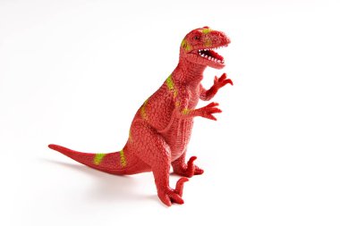 Beyaz arka planda dinozor kauçuk oyuncak. Predator. Kırmızı tyrannosaurus.