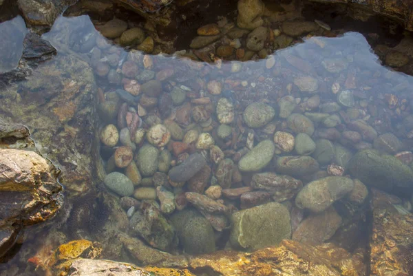 Background of rock piles in the water — Stock Photo, Image