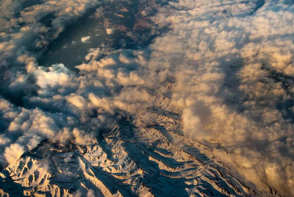 Alp snowy mountains beautiful sky and clouds Stock Image