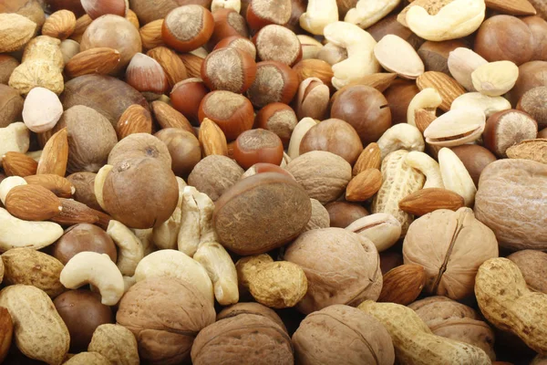 Variety of nuts, food background.