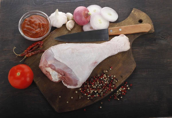 stock image Closeup of meat with assorted vegetables over dark wooden background 