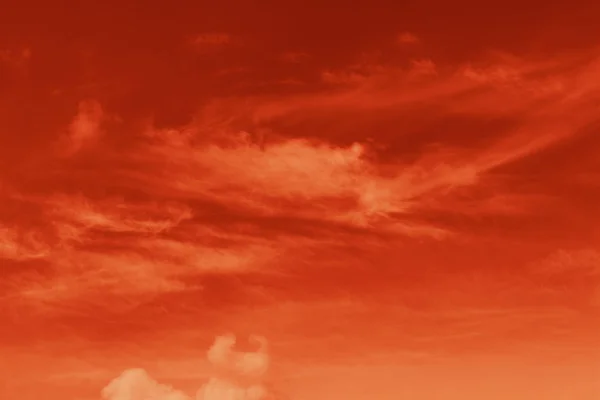 Bright background with red sky and clouds
