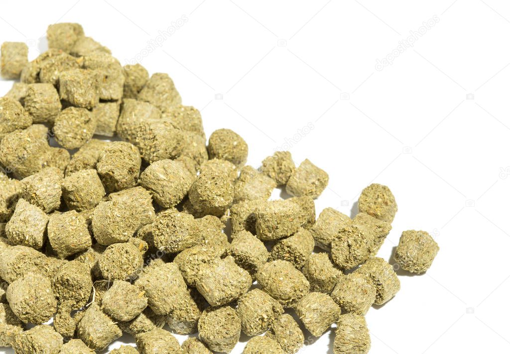 Rabbit feed pellets on a white background