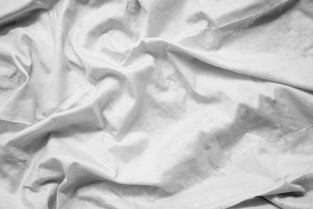 White fabric abstract background concept. white wrinkled silk cloth wave texture satin material 