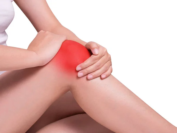 Woman's hand holding around knee suffering from knee pain, joint pains. red color highlight at knee isolated on white background. health care and medical concept. studio shot — 스톡 사진