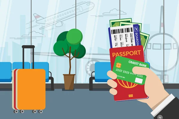 Obchodní muž držící pas, palubní lístek, kapesné a kreditní karty, připravte se na cestování s zavazadly a letištním terminálem na pozadí. vektorový ilustrace plochý design — Stockový vektor