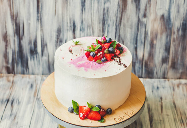 Flamingo cake with berries at the party