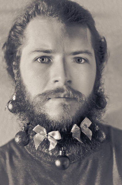 young Bearded man decorated for Christmas party