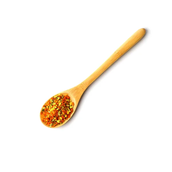 Wooden spoon with spices of dry herbs and vegetables — Stock Photo, Image