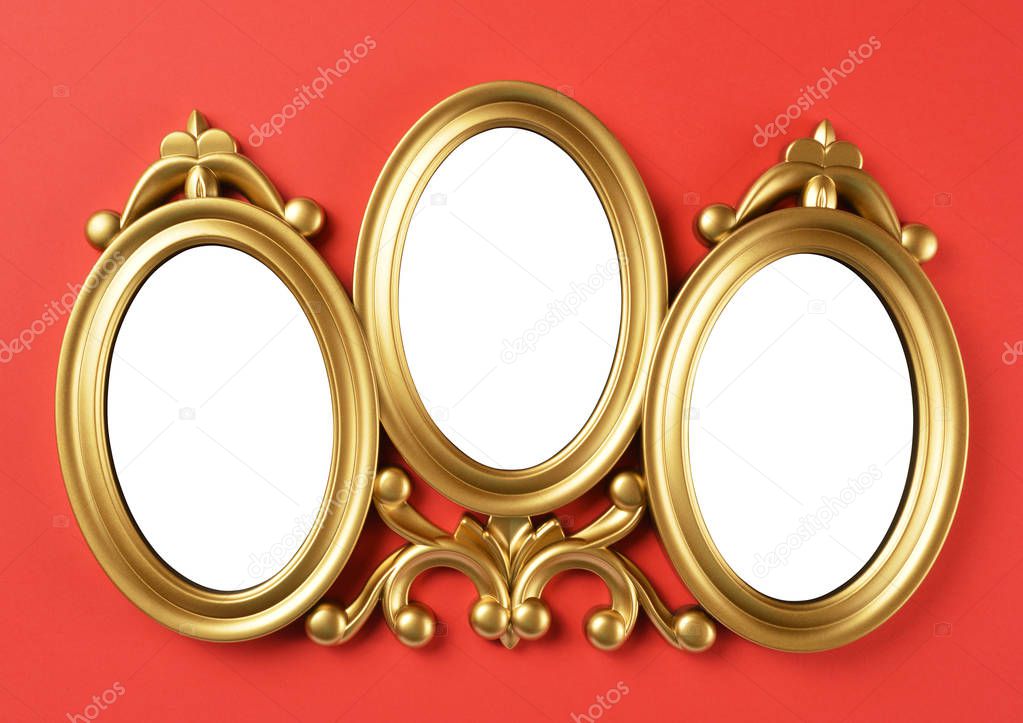 Picture frames with clipping path hanging on red wall background