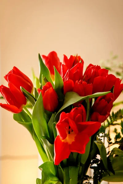 Bouquet of red spring tulips in office space