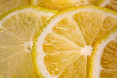 Limon arka planı. Limon dilimlerinin yakın görüntüsü. Citrus dokusu