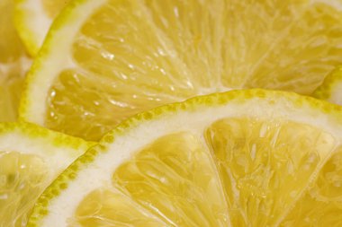 Limon arka planı. Limon dilimlerinin yakın görüntüsü. Citrus dokusu