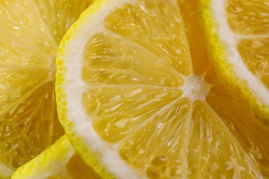 Limon arka planı. Limon dilimlerinin yakın görüntüsü. Citrus dokusu