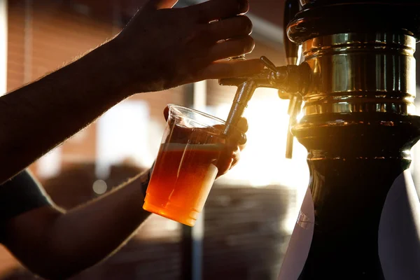Pouring Beer Plastic Glass Sunset — Stock Photo, Image