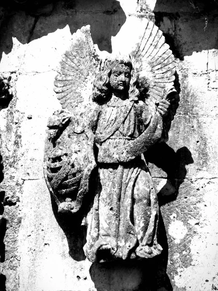 Grotesque, Angel face carving in stone