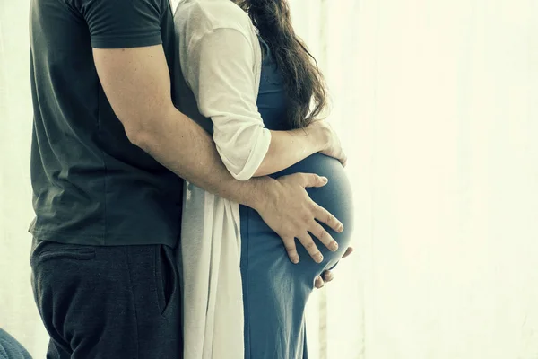 Loving Man Hugging His Pregnant Wife Standing Home Pregnancy People — Stock Photo, Image