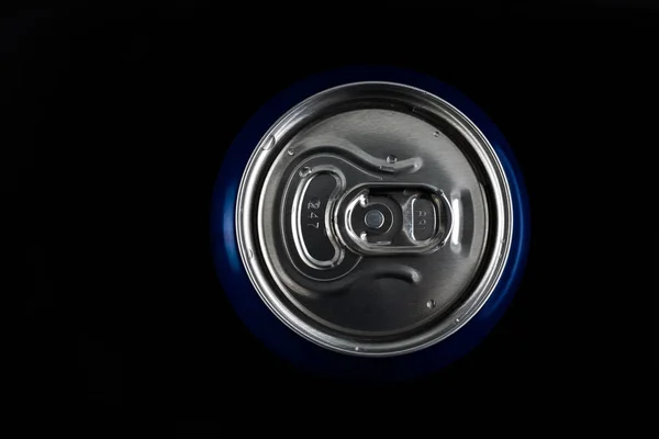 metal can with a drink on top