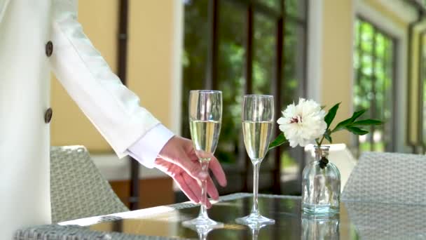Waiter Pours Champagne Glasses Table Restaurant Wine Glasses Summer Terrace — Stock Video