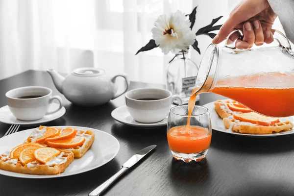 Man White Robe Pours Glass Orange Juice Breakfast Hotel Pancakes — Stock Photo, Image