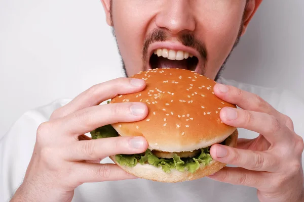 Portrait Young Man Opens His Mouth Wide Bite Burger Close Royalty Free Stock Photos