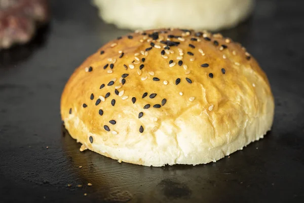 burger bread toasting on griddle