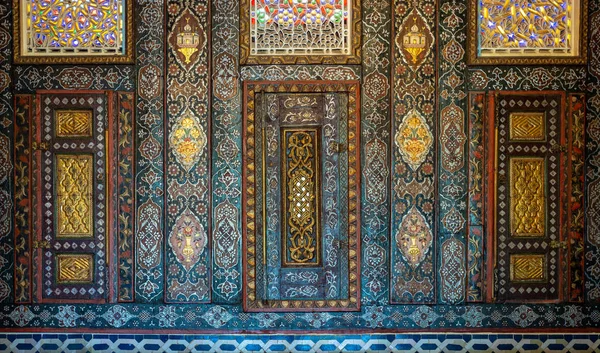 Floral ornaments of wooden embedded cupboards painted with colored geometrical patterns, Syrian hall of historic Manial palace of Prince Mohammed Ali, Cairo, Egypt