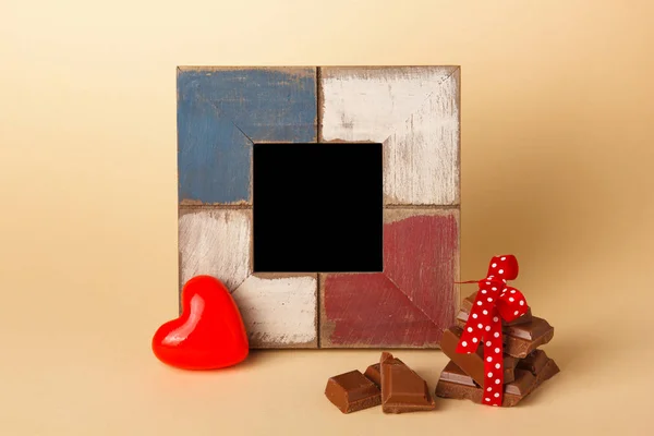 Frame for a photo or text. Frame, heart, chocolate. Background for Valentine\'s Day.