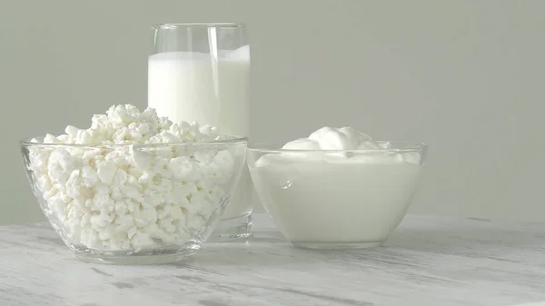 A group of environmentally friendly non-GMO dairy products, yogurt, cottage cheese, sour cream and cheese on the bottom of the pod.