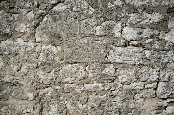Vecchio muro di pietra Grungy e intemperie — Foto Stock