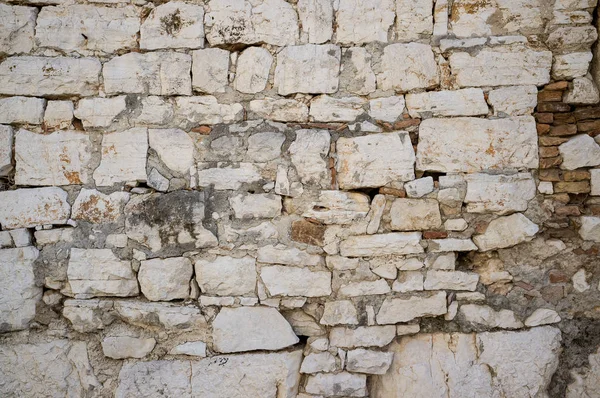 Oude grungy en verweerde stenen muur — Stockfoto