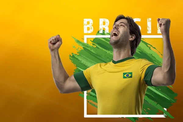 Brazilian Soccer Player Celebrating Yellow Background Copy Space — Stock Photo, Image