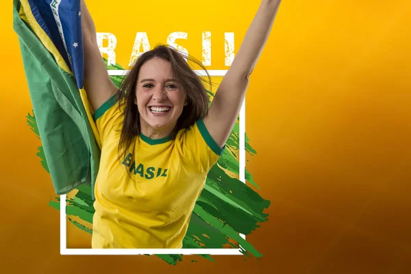 Brazilian woman fan, celebrating on a yellow background with copy space.