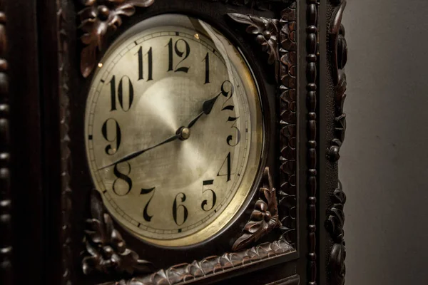 An old grandfather clock on a fancy room. Close up.