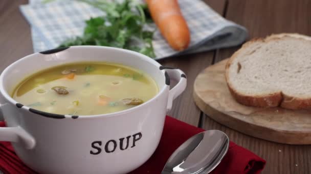 A bowl of delicious brazilian soup with beef, vegetables, noodles, carrots, and potato. — Stock Footage Bowl Delicious Brazilian Soup Beef Vegetables Noodles Carrots Potato Stock Video